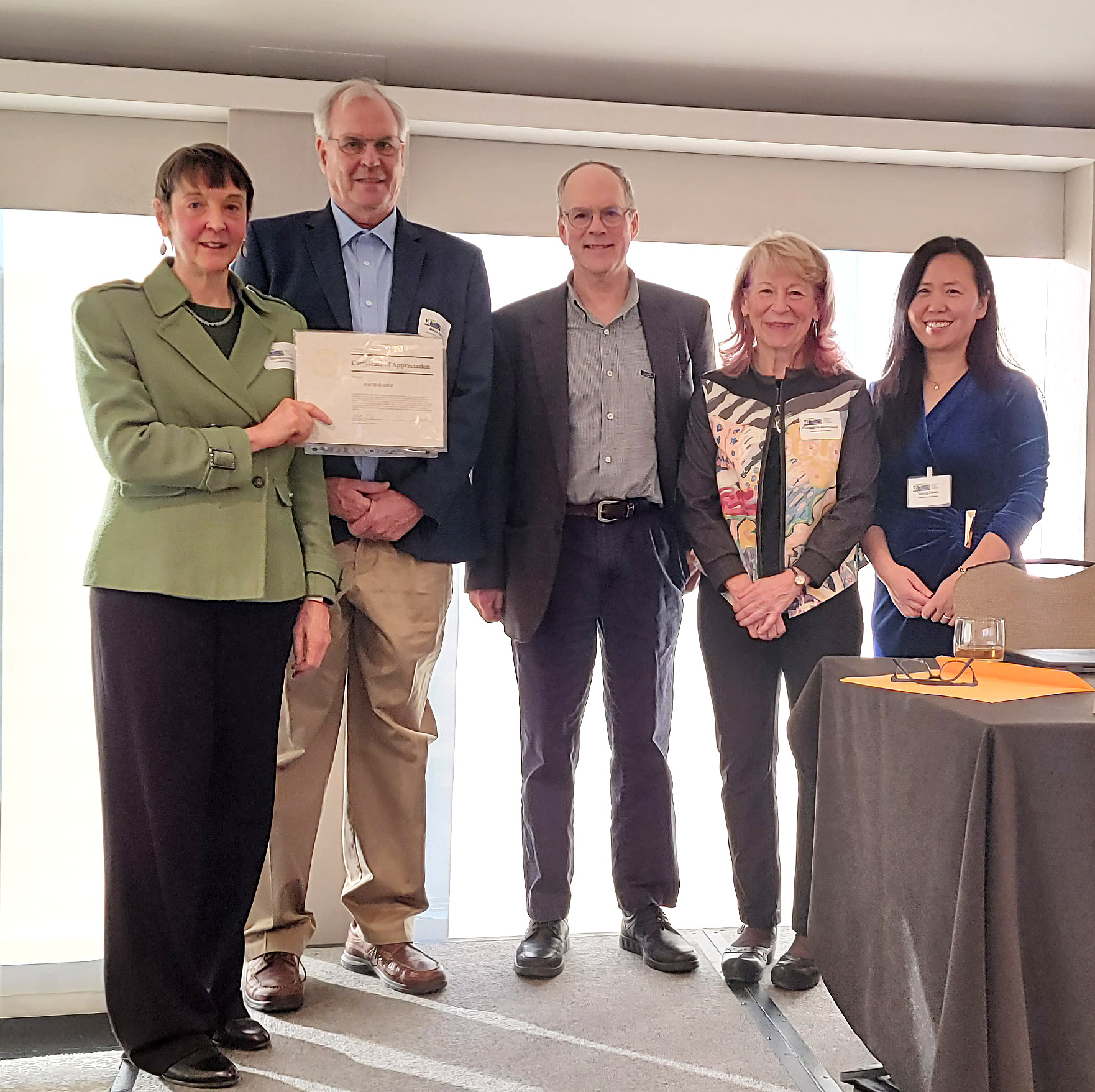 Figure 2. Dr. Dorothy Koch presents DOE Certificate of Appreciation to the E3SM Project’s PI, Dr. Dave Bader. Left to right: Dr. Dorothy Koch, Dr. Dave Bader, Dr. Gary Geernaert, Dr. Geri Richmond, Dr. Xujing Davis.